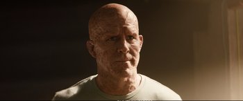 Movie still from “Deadpool 2” (2018), directed by David Leitch – A bald man is looking at the camera; Close Up shot, Low angle