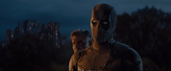 Movie still from “Deadpool 2” (2018), directed by David Leitch – A man and a woman dressed as deadpool; Close Up shot, Low angle