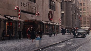 Movie still from “The Godfather” (1972), directed by Francis Ford Coppola – A group of people walking down a street near a building; Extreme Wide shot, High angle