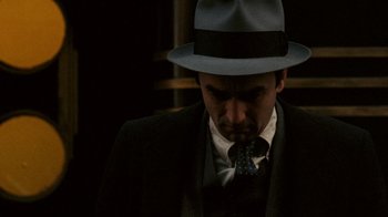 Movie still from “The Godfather” (1972), directed by Francis Ford Coppola – A man wearing a suit and a hat; Close Up shot, Low angle