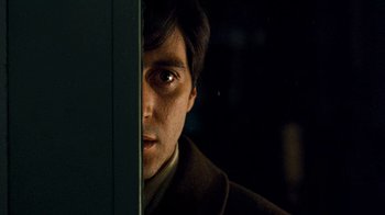 Movie still from “The Godfather” (1972), directed by Francis Ford Coppola – A person looking at the camera; Close Up shot, Low angle