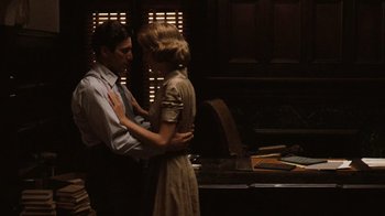 Movie still from “The Godfather” (1972), directed by Francis Ford Coppola – A man and a woman standing next to each other in a room; Medium shot, Low angle