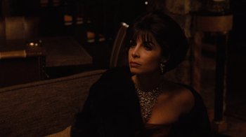 Movie still from “The Godfather Part II” (1974), directed by Francis Ford Coppola – A woman in a black dress and a black hat; Close Up shot, High angle