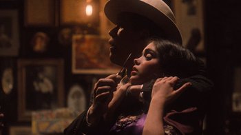 Movie still from “The Godfather Part II” (1974), directed by Francis Ford Coppola – A man and a woman are posing for a picture; Close Up shot, Over the shoulder angle