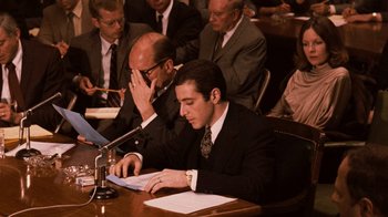 Movie still from “The Godfather Part II” (1974), directed by Francis Ford Coppola – A group of men sitting around a table; Medium shot, Over the shoulder angle