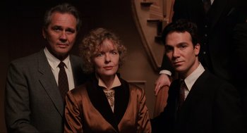 Movie still from “The Godfather Part III” (1990), directed by Francis Ford Coppola – A group of people standing next to each other in a room; Medium shot, Low angle