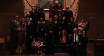 Movie still from “The Godfather Part III” (1990), directed by Francis Ford Coppola – A group of people standing on the stairs of a house; Wide shot, High angle