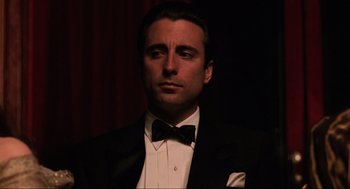 Movie still from “The Godfather Part III” (1990), directed by Francis Ford Coppola – A man wearing a tuxedo and a bow tie; Close Up shot, Low angle