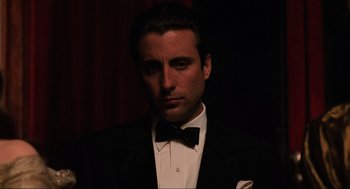 Movie still from “The Godfather Part III” (1990), directed by Francis Ford Coppola – A man wearing a tuxedo and a bow tie; Close Up shot, Low angle