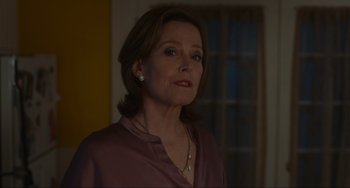 Movie still from “The Good House” (2021), directed by Maya Forbes – A person standing in a room near a window; Close Up shot, Low angle