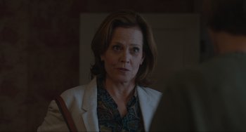 Movie still from “The Good House” (2021), directed by Maya Forbes – A person wearing a jacket; Close Up shot, Over the shoulder angle