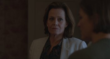 Movie still from “The Good House” (2021), directed by Maya Forbes – A person wearing a jacket; Close Up shot, Over the shoulder angle