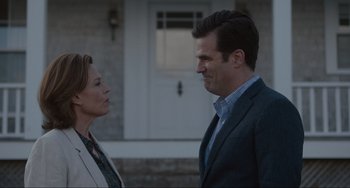 Movie still from “The Good House” (2021), directed by Maya Forbes – A man and a woman standing next to each other outside; Medium shot, Over the shoulder angle