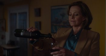 Movie still from “The Good House” (2021), directed by Maya Forbes – A woman pouring wine into a wine glass; Close Up shot, Over the shoulder angle