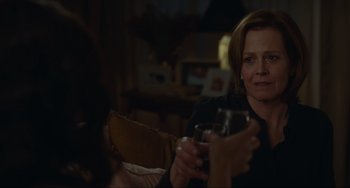 Movie still from “The Good House” (2021), directed by Maya Forbes – A woman holding a wine glass in her hand; Close Up shot, Over the shoulder angle
