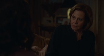 Movie still from “The Good House” (2021), directed by Maya Forbes – An older woman sitting on a chair in a dark room; Close Up shot, Over the shoulder angle