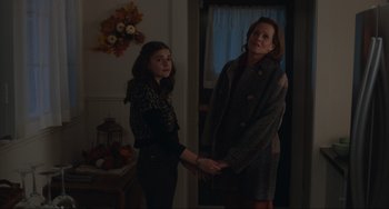 Movie still from “The Good House” (2021), directed by Maya Forbes – Two people holding hands in a room; Medium shot, Over the shoulder angle