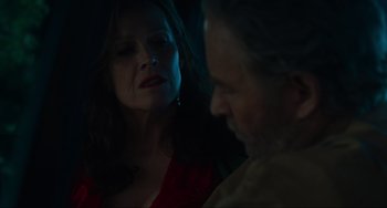 Movie still from “The Good House” (2021), directed by Maya Forbes – An older man and a younger woman in a dark room; Close Up shot, Over the shoulder angle