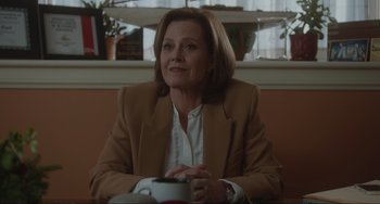 Movie still from “The Good House” (2021), directed by Maya Forbes – A woman sitting in front of a window in a room; Medium shot, Over the shoulder angle