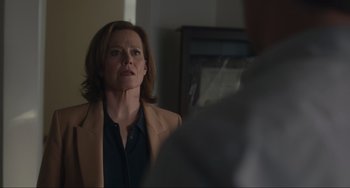 Movie still from “The Good House” (2021), directed by Maya Forbes – A woman looking at the camera in the mirror; Medium shot, Over the shoulder angle