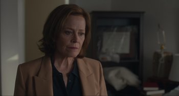 Movie still from “The Good House” (2021), directed by Maya Forbes – A person wearing a jacket; Close Up shot, Over the shoulder angle