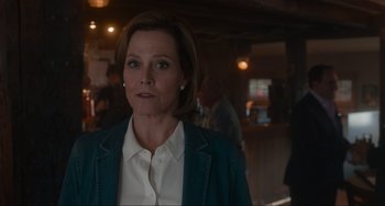 Movie still from “The Good House” (2021), directed by Maya Forbes – A person wearing a jacket; Close Up shot, Over the shoulder angle