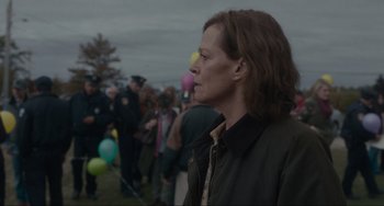Movie still from “The Good House” (2021), directed by Maya Forbes – A woman standing in front of a group of people; Medium shot, Over the shoulder angle
