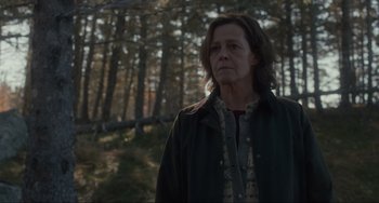 Movie still from “The Good House” (2021), directed by Maya Forbes – A woman standing in the middle of a forest; Medium shot, Low angle
