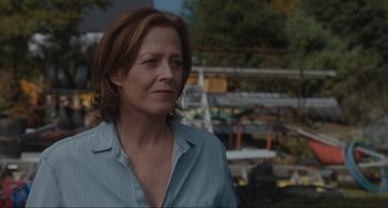 Movie still from “The Good House” (2021), directed by Maya Forbes – A person wearing a blue shirt; Close Up shot, Over the shoulder angle