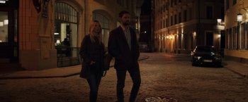 Movie still from “The Good Neighbor” (2022), directed by Stephan Rick – A man and a woman walking down a street at night; Wide shot, Low angle