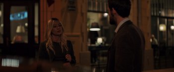 Movie still from “The Good Neighbor” (2022), directed by Stephan Rick – A man and a woman are talking in a room; Medium shot, Over the shoulder angle