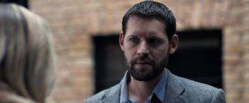 Movie still from “The Good Neighbor” (2022), directed by Stephan Rick – A person with a beard; Close Up shot, Over the shoulder angle