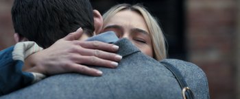 Movie still from “The Good Neighbor” (2022), directed by Stephan Rick – A man and a woman embracing each other; Extreme Close Up shot, Over the shoulder angle