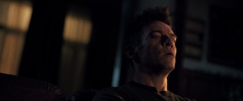 Movie still from “The Good Neighbor” (2022), directed by Stephan Rick – A person sitting in a chair; Close Up shot, Low angle