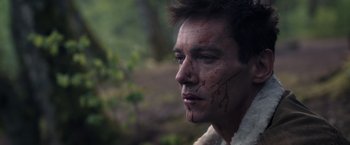 Movie still from “The Good Neighbor” (2022), directed by Stephan Rick – A person with blood on his face; Close Up shot, High angle