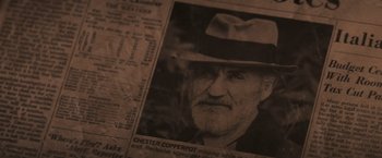 Movie still from “The Goonies” (1985), directed by Richard Donner – An old photo of a man with a hat on; Extreme Close Up shot, High angle