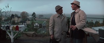 Movie still from “The Goonies” (1985), directed by Richard Donner – Two men standing next to each other on a hill; Medium shot, Over the shoulder angle