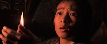 Movie still from “The Goonies” (1985), directed by Richard Donner – A person looking at the camera; Close Up shot, High angle