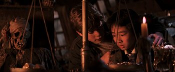 Movie still from “The Goonies” (1985), directed by Richard Donner – Two young boys are looking at something in a mirror; Close Up shot, High angle