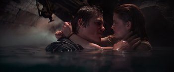 Movie still from “The Goonies” (1985), directed by Richard Donner – A man and a woman in a body of water; Close Up shot, High angle