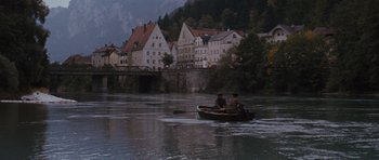 Movie still from “The Great Escape” (1963), directed by John Sturges – Two men are in a boat on a river; Extreme Wide shot, High angle