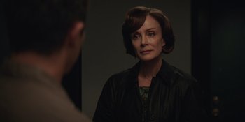 Movie still from “The Greatest Beer Run Ever” (2022), directed by Peter Farrelly – A woman looking into a mirror while standing up; Close Up shot, Over the shoulder angle