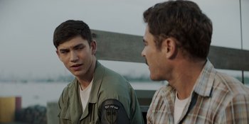 Movie still from “The Greatest Beer Run Ever” (2022), directed by Peter Farrelly – Two young men are sitting next to each other; Close Up shot, Over the shoulder angle