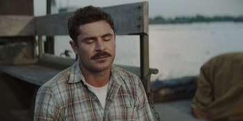 Movie still from “The Greatest Beer Run Ever” (2022), directed by Peter Farrelly – A person with a mustache wearing a plaid shirt; Close Up shot, Over the shoulder angle