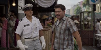 Movie still from “The Greatest Beer Run Ever” (2022), directed by Peter Farrelly – A man walking next to a man in a uniform; Medium shot, Over the shoulder angle