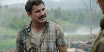 Movie still from “The Greatest Beer Run Ever” (2022), directed by Peter Farrelly – A person wearing a shirt; Close Up shot, Over the shoulder angle