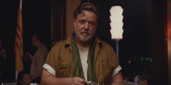 Movie still from “The Greatest Beer Run Ever” (2022), directed by Peter Farrelly – A person holding a camera in a room; Close Up shot, Low angle