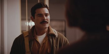 Movie still from “The Greatest Beer Run Ever” (2022), directed by Peter Farrelly – A man with a mustache is looking at a mirror; Close Up shot, Over the shoulder angle