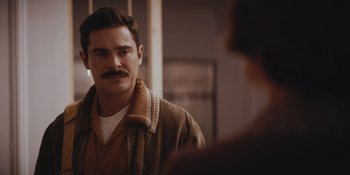 Movie still from “The Greatest Beer Run Ever” (2022), directed by Peter Farrelly – A man with a mustache standing in front of a mirror; Close Up shot, Over the shoulder angle