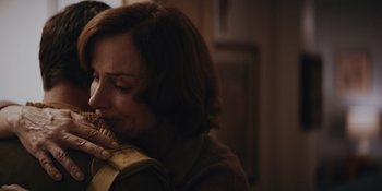 Movie still from “The Greatest Beer Run Ever” (2022), directed by Peter Farrelly – A woman is holding a piece of food in her hands; Close Up shot, Over the shoulder angle